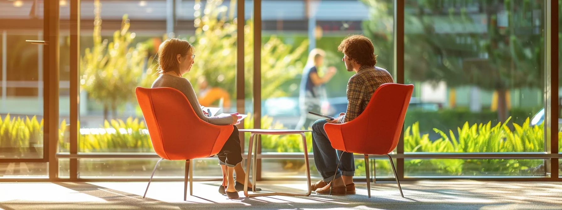 a person sitting with a coach, engaged in deep conversation about managing stress and setting realistic expectations for progress.