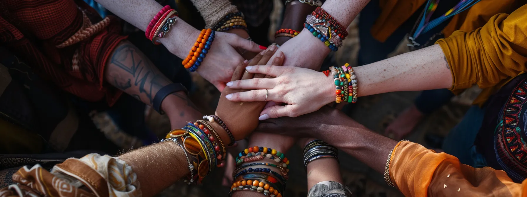 a group of people wearing fair trade gemstone bracelets, showcasing their commitment to ethical fashion and sustainability.