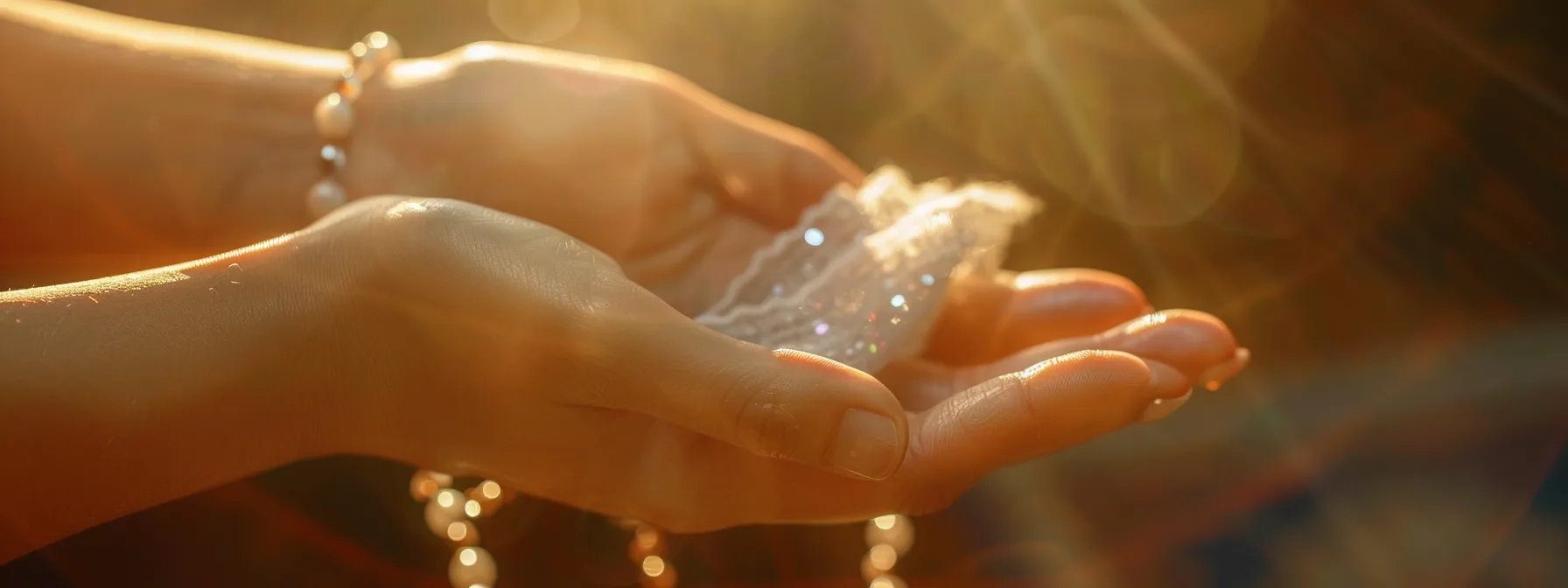 a hand holding a soft cloth, gently wiping a sparkling natural gemstone bracelet.