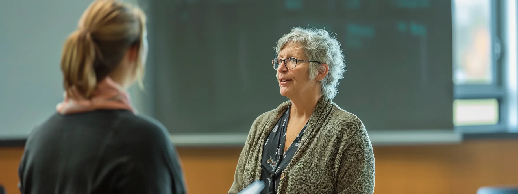 a person attending a workshop with a mentor discussing career advancement plans.