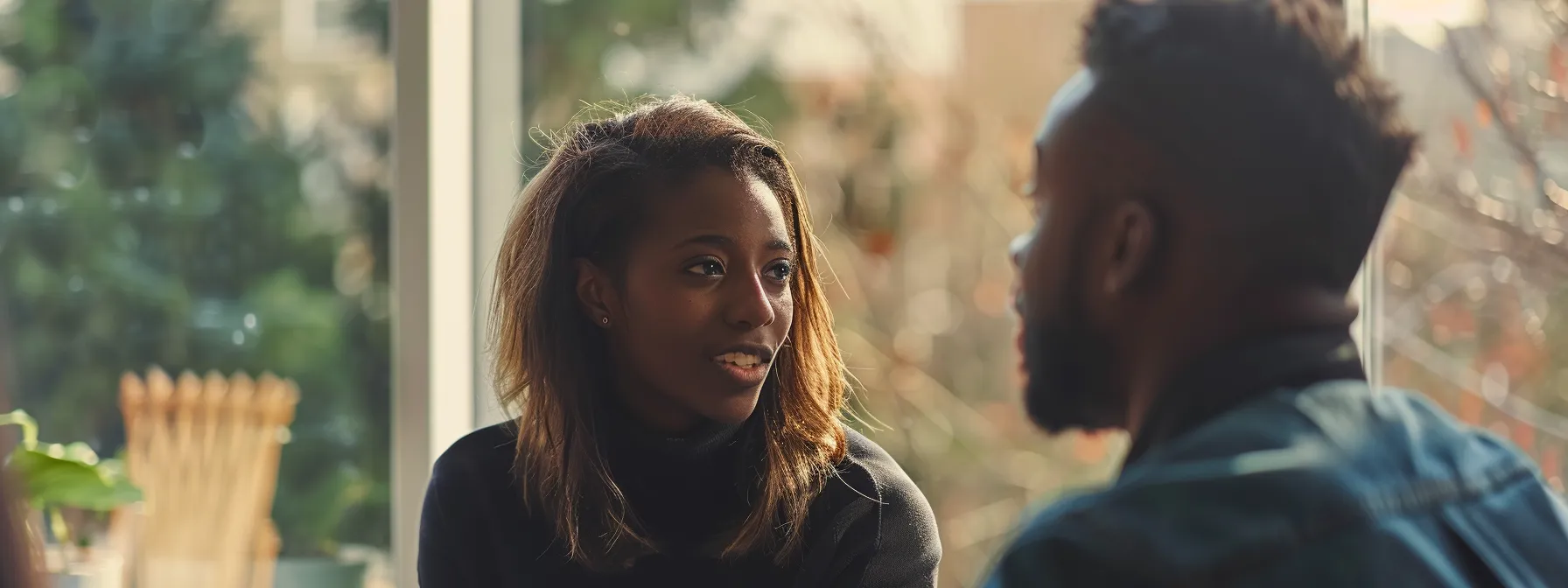 a person engaging in a deep conversation with a coach using body language and eye contact to communicate effectively.