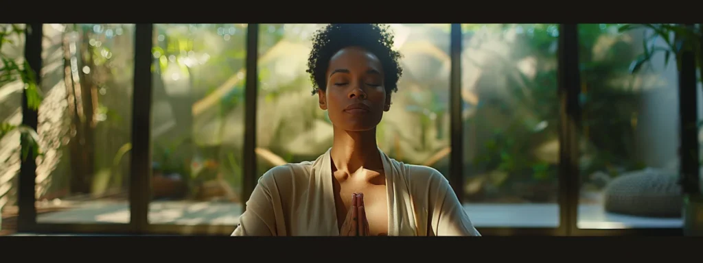 a person sitting with eyes closed in meditation, surrounded by a peaceful and serene environment.