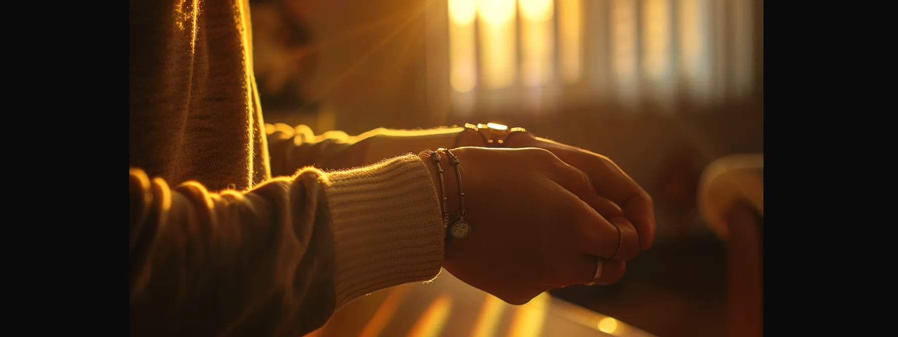 a person adjusting a bracelet clasp for a perfect fit.