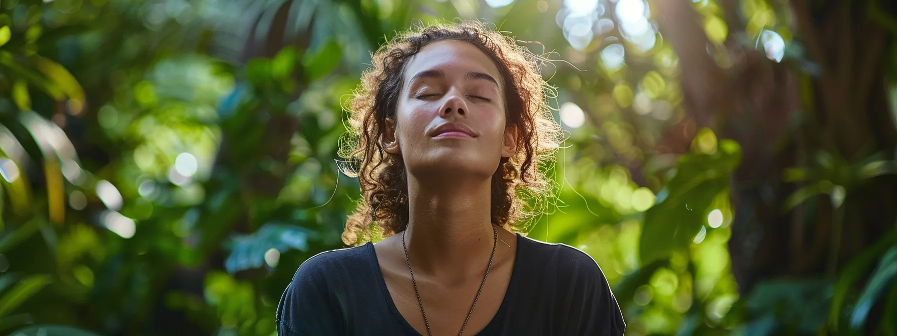 participants meditating in a serene natural setting, surrounded by lush greenery, with their eyes closed and a sense of inner peace radiating from their expression.