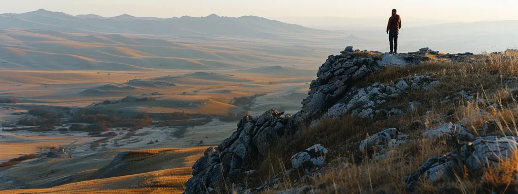 a person standing at the top of a mountain, looking out at a vast landscape, symbolizing personal growth and achievement through smart goal setting.