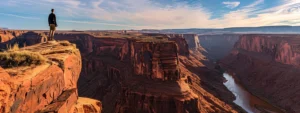 a person standing at the edge of a cliff overlooking a vast, untouched landscape, inspiring creativity and innovative thinking.