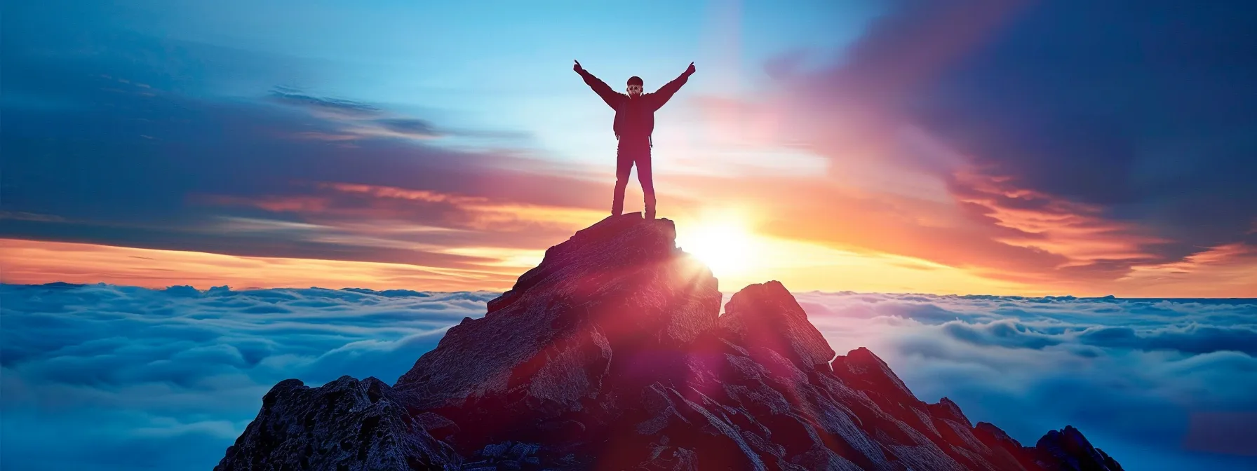 a person confidently standing on top of a mountain, symbolizing personal growth and achievement through smart goal setting.