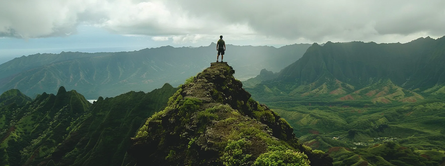 in a serene setting, a person stands confidently atop a mountain peak, gazing out at the expansive horizon, embodying self-compassion, resilience, and a mindset focused on growth and learning.