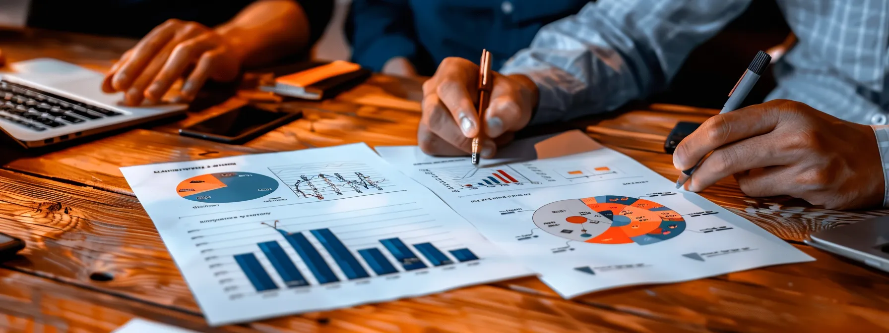 two individuals sitting together at a desk, surrounded by productivity tools and charts, discussing their goals and holding each other accountable.