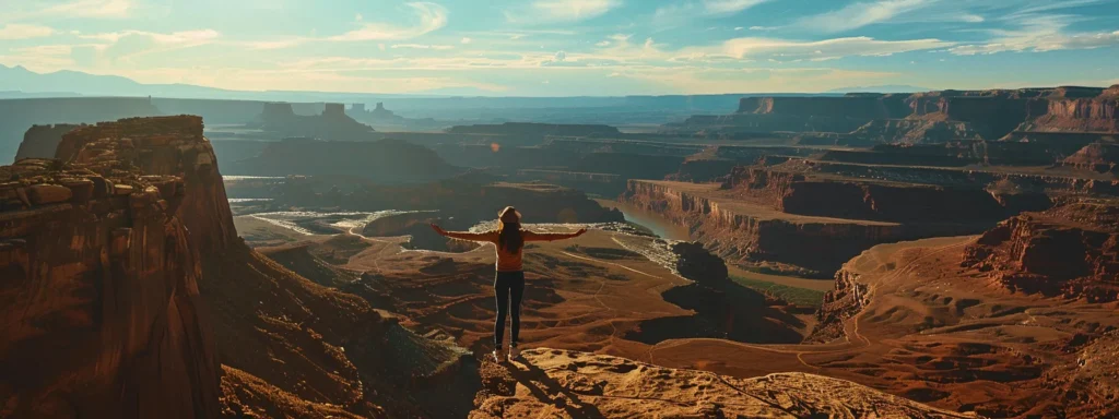 a person standing at the edge of a cliff, spreading their arms wide as they look out at a vast, open landscape, symbolizing unlocking their potential with psych-k techniques.