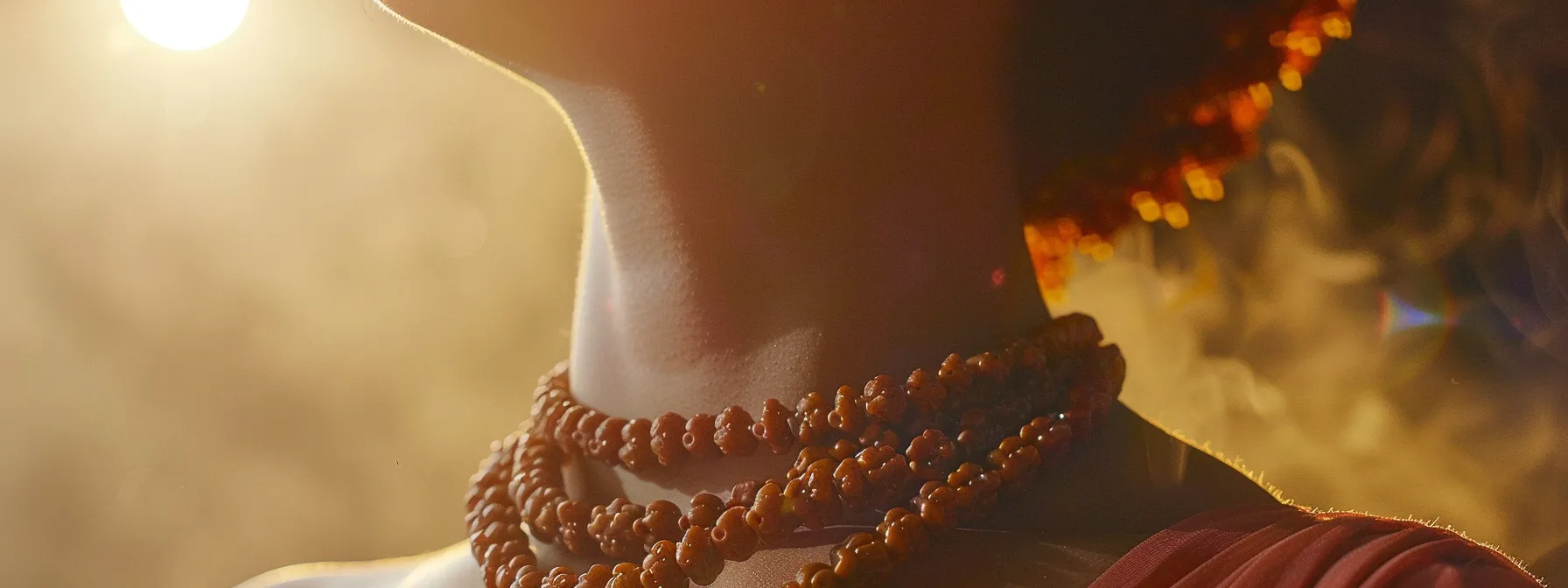 a close-up photo of a person wearing a rudraksha necklace, with a subtle electromagnetic aura emanating from the beads, illustrating the interaction between rudraksha's properties and the human body.