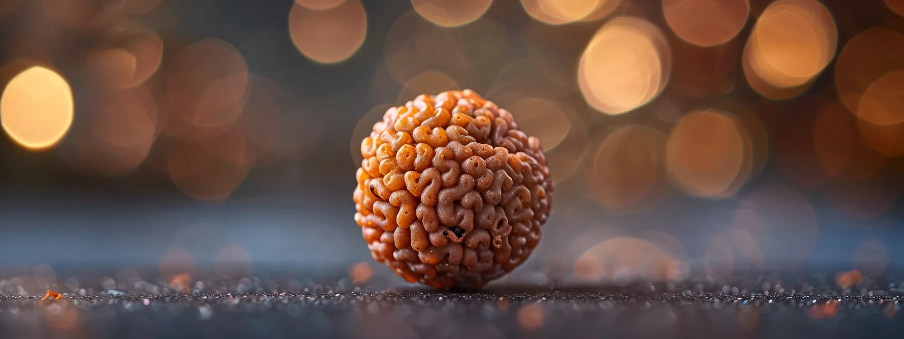 a close-up photo of a luminous one mukhi rudraksha bead, radiating tranquility and spiritual energy.