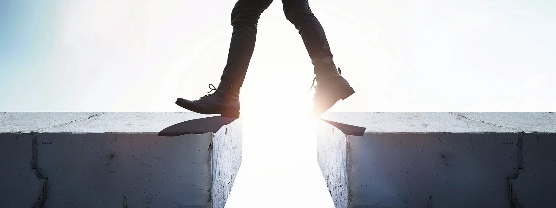 a person confidently stepping over a gap, symbolizing overcoming limiting beliefs and bridging the knowing-doing gap.