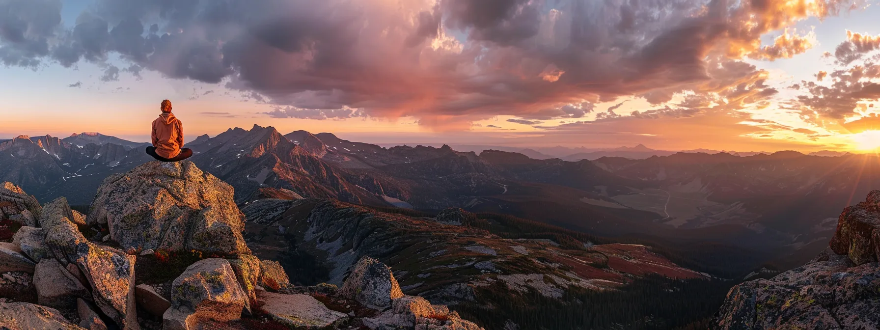 a person sitting cross-legged on a mountain peak, eyes closed in deep meditation, surrounded by vibrant colors of a sunrise, embodying focus and empowerment.