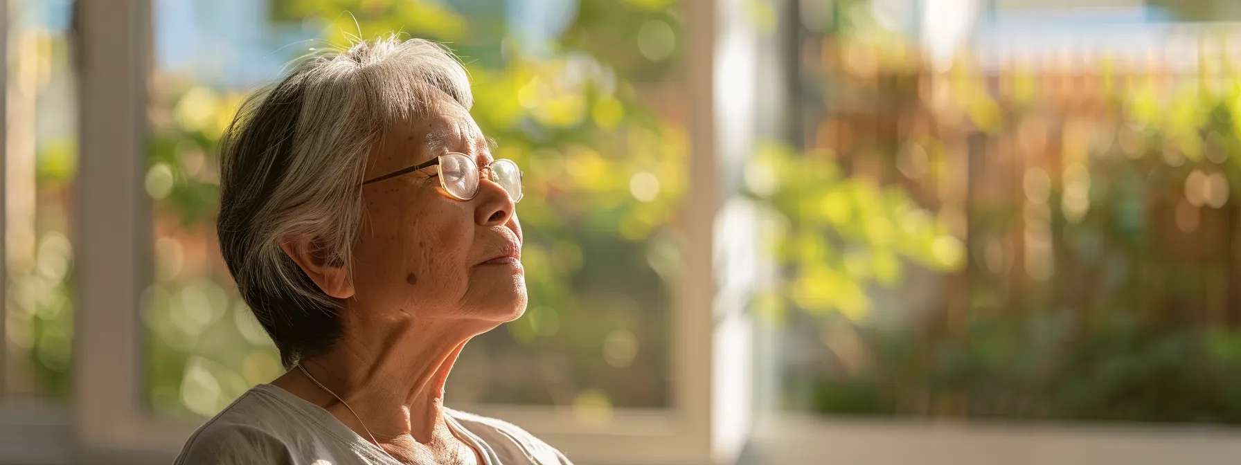 a person sitting in a peaceful setting, eyes closed, practicing heart-focused breathing to enhance emotional resilience.