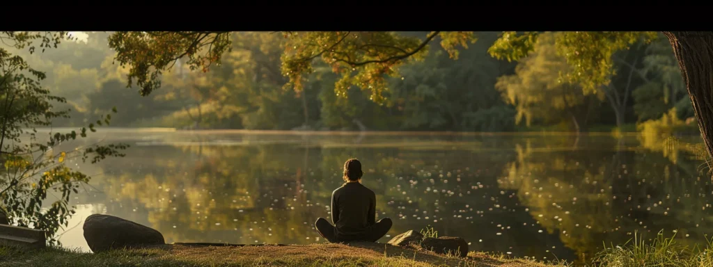 a person sitting peacefully by a tranquil lake, practicing heartmath techniques for enhanced stress management.