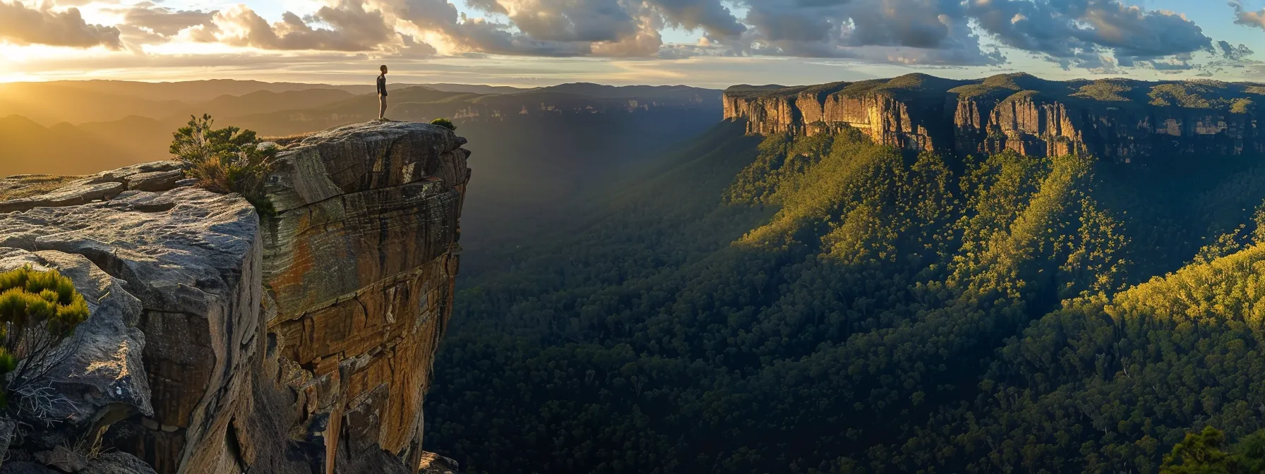 a person standing on a cliff overlooking a vast australian landscape, visualizing success with a strong sense of determination and focus.