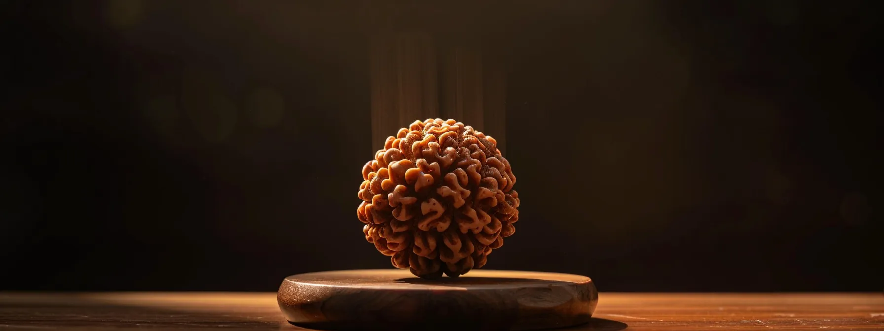 a serene image of a thirteen mukhi rudraksha glowing with a soothing aura, symbolizing hormonal balance, mental clarity, and immune system strength.