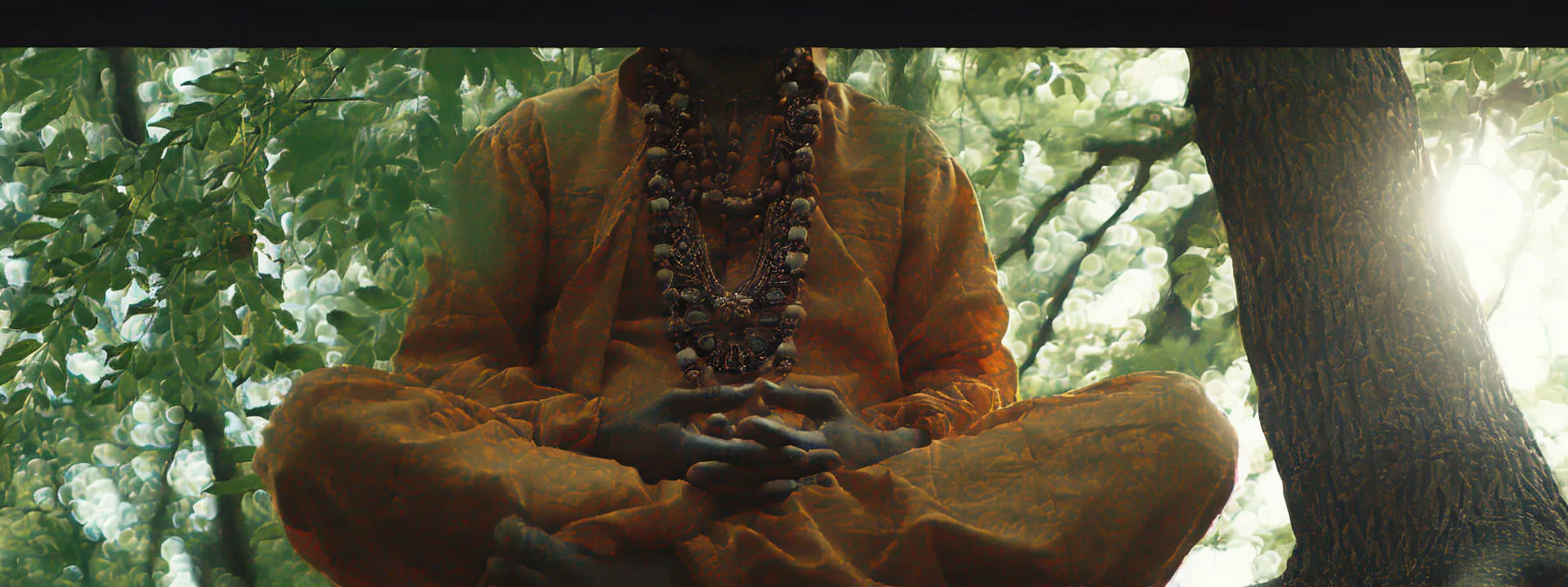 a serene individual meditating under a peaceful tree with a one mukhi rudraksha bead around their neck.