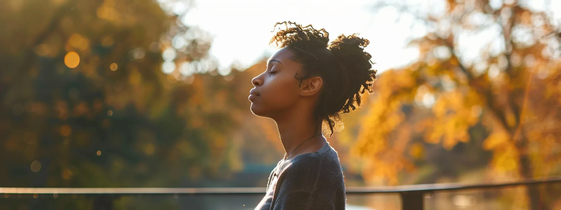 a serene individual standing confidently on a bridge, symbolizing the elimination of self-limiting beliefs through the implementation of psych-k methods.