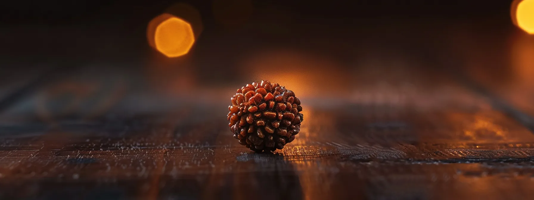 a solitary one mukhi rudraksha bead gleams under soft light, radiating a sense of ancient wisdom and spiritual significance.