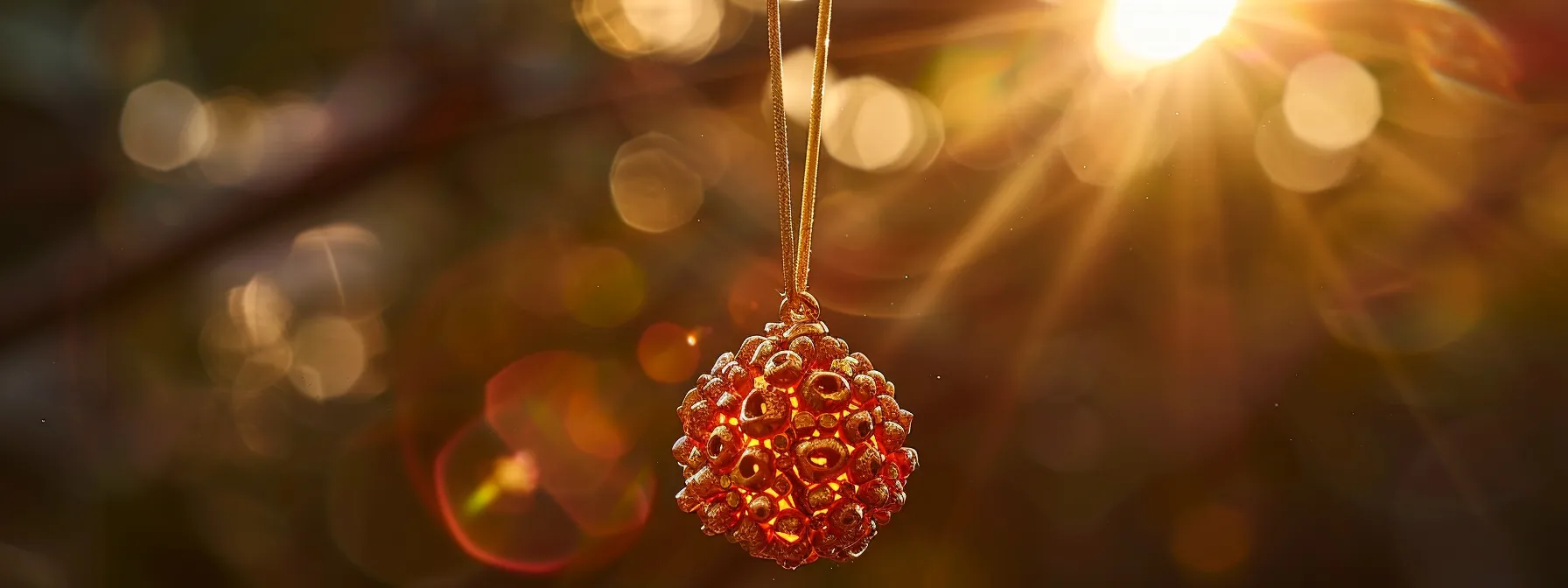 a radiant four mukhi rudraksha pendant glistening in the sunlight, symbolizing wisdom and effective communication.