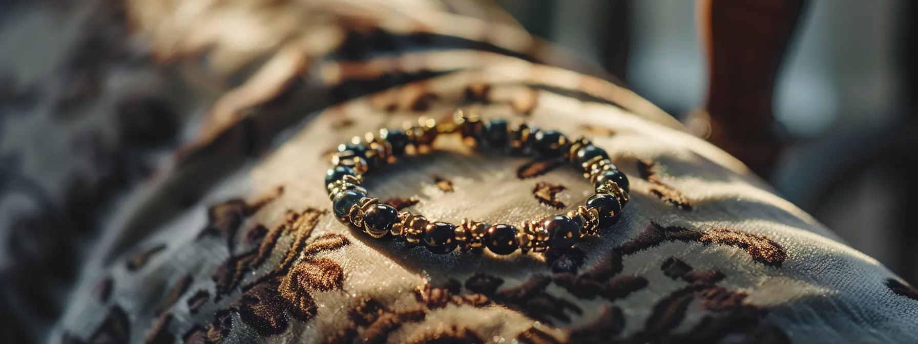 a shimmering onyx bracelet delicately placed on a soft velvet cushion, gleaming under warm natural light.